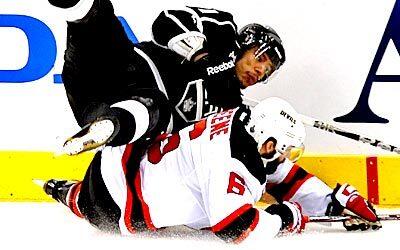 The Kings' Jordan Nolan collides with the Devils' Andy Greene in the 1st period of Game 4 of the Stanley Cup Final at Staples Center.