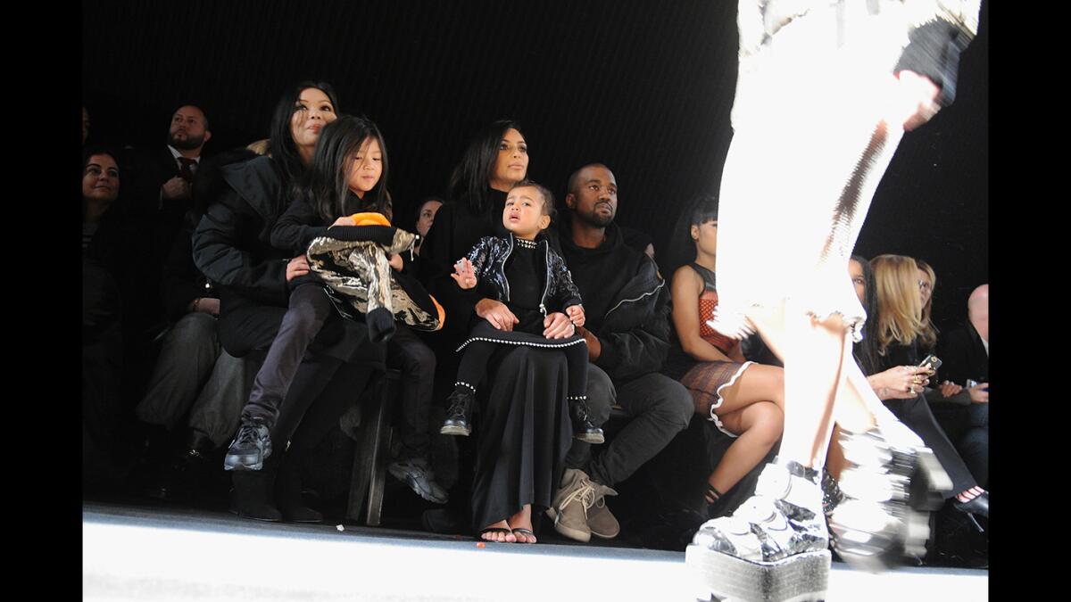 Aimie Wang, Alia Wang, Kim Kardashian, North West and Kanye West attend the Alexander Wang Fashion Show during Mercedes-Benz Fashion Week Fall 2015 at Pier 94 on Saturday in New York City.