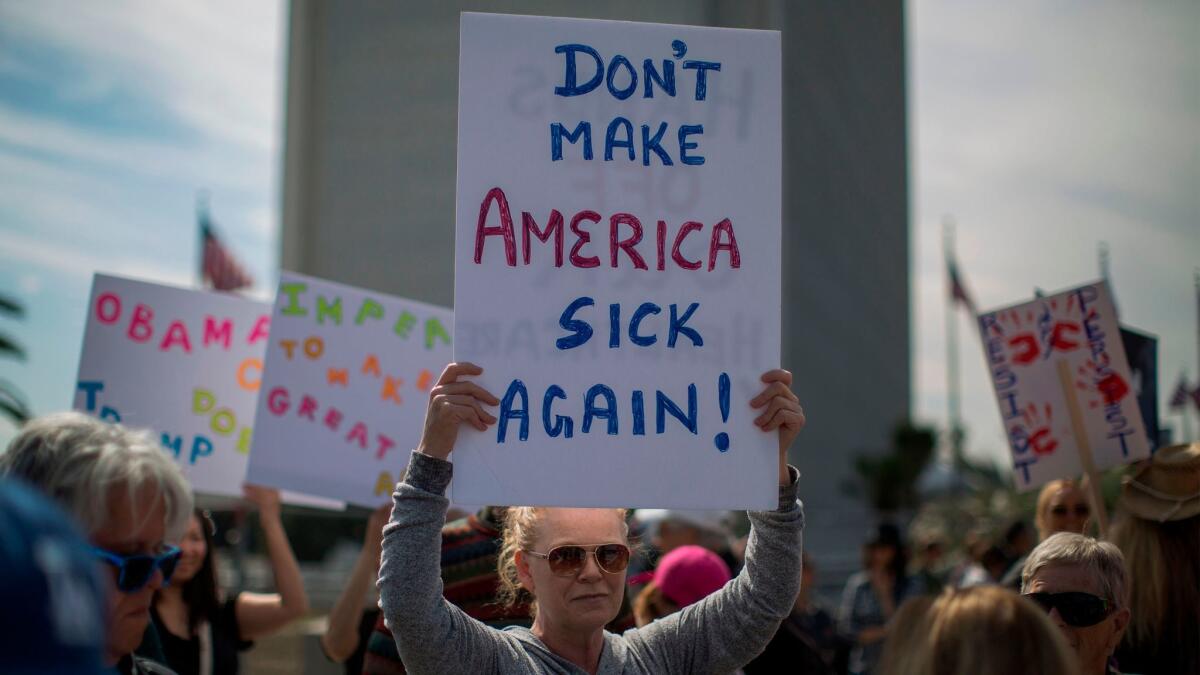 People in Los Angeles protest Trump administration policies that threaten Medicare and Medicaid on Feb. 25, 2017.