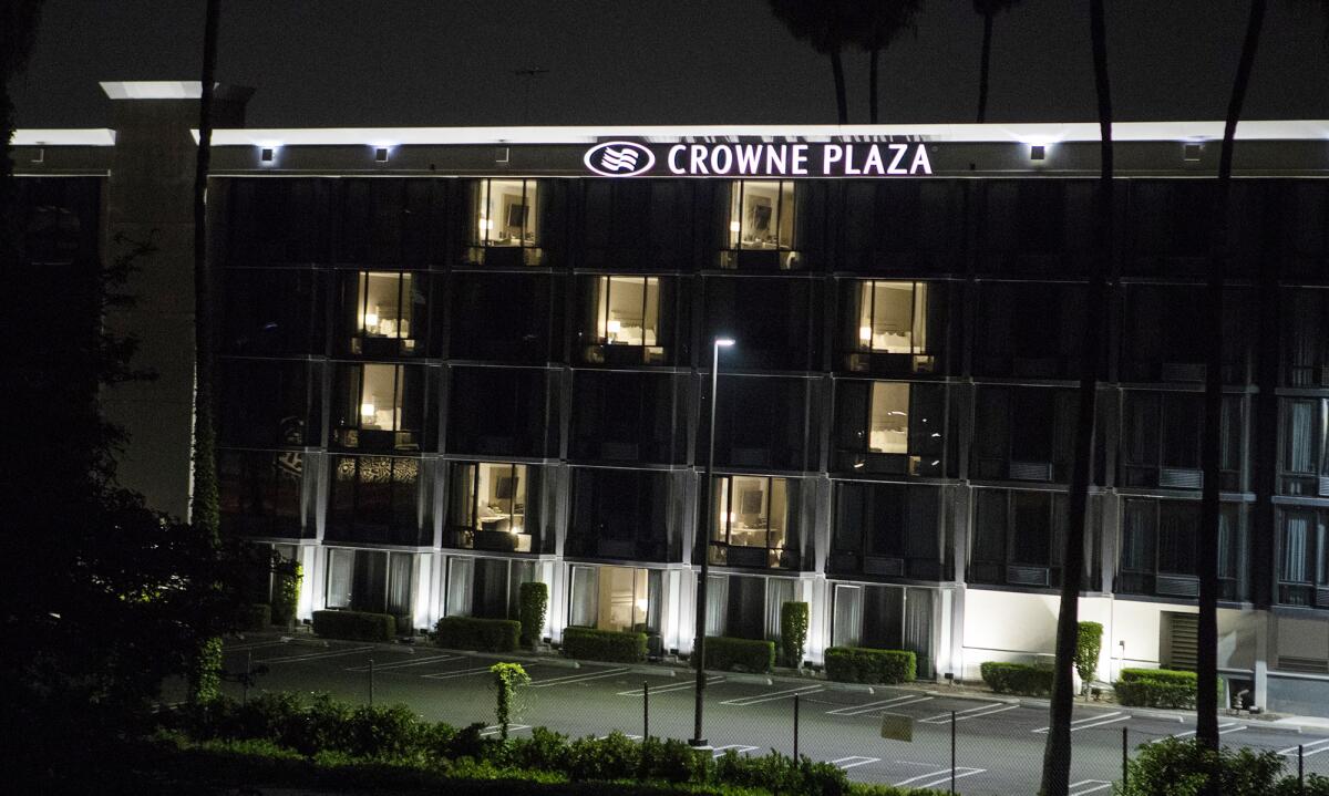 The Crowne Plaza Costa Mesa Orange County lights windows in the shape of a heart on Tuesday.