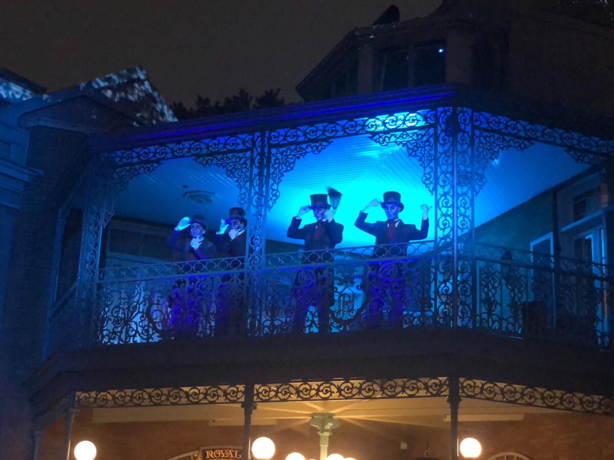 Ghostly carolers sang at an event to celebrate the 50th anniversary of the Haunted Mansion.