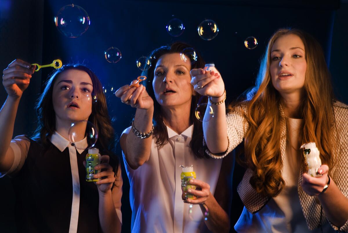 Maisie Williams, Michelle Fairley and Sophie Turner in 2013.