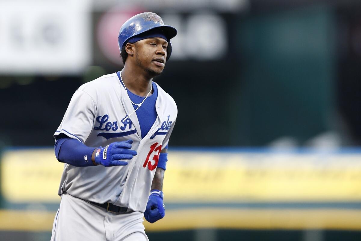 Dodgers shortstop Hanley Ramirez round the bases after hitting a two-run home run during the first inning of the Dodgers' 3-2 loss to the Cincinnati Reds on Friday.