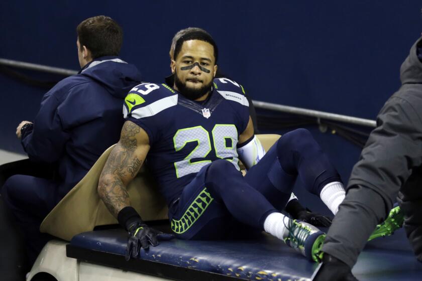 Seahawks safety Earl Thomas leaves the field on a cart after being injured against the Carolina Panthers in the first half on Dec. 4.