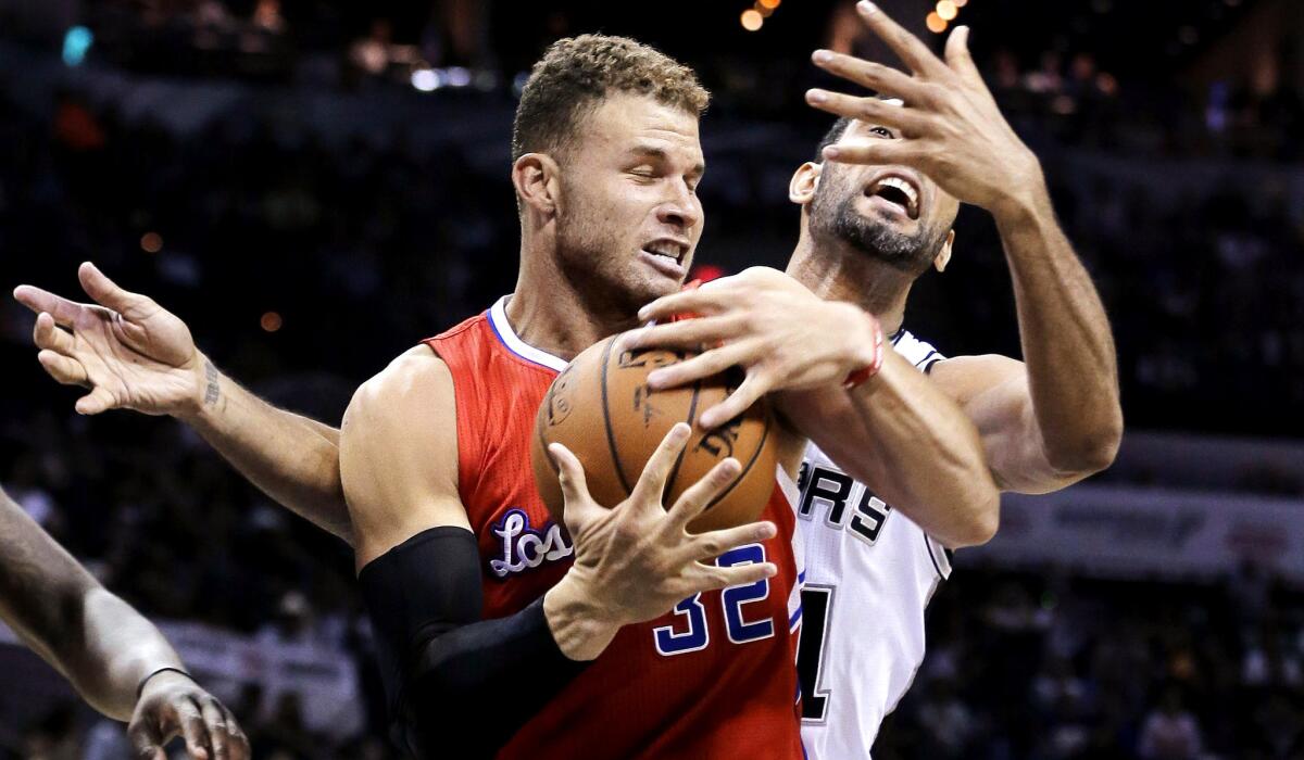 Clippers forward Blake Griffin pulls down a rebound against Spurs forward Tim Duncan during the second half of Game 3 in their first-round playoff series in San Antonio on April 24.