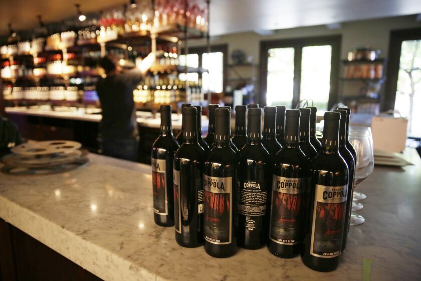 FILE - Bottles of Apocalypse Now Red Blend wine stand on a tasting bar counter at the Francis Ford Coppola Winery, May 21, 2020, in Geyserville, Calif. California will add wine and liquor bottles to its recycling rebate program under a law taking effect in July 2024. Senate President Pro Tempore Toni Atkins said Wednesday, Sept. 28, 2022, that the state's recycling program has needed fixing for decades. (AP Photo/Eric Risberg, File)