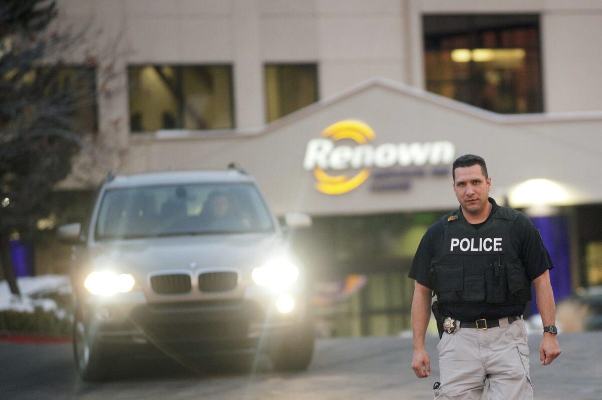 Reno Police officer Carlos Valles is pictured at the Renown Regional Medical Center during a lockdown in Reno, Nevada on Dec. 17, 2013.