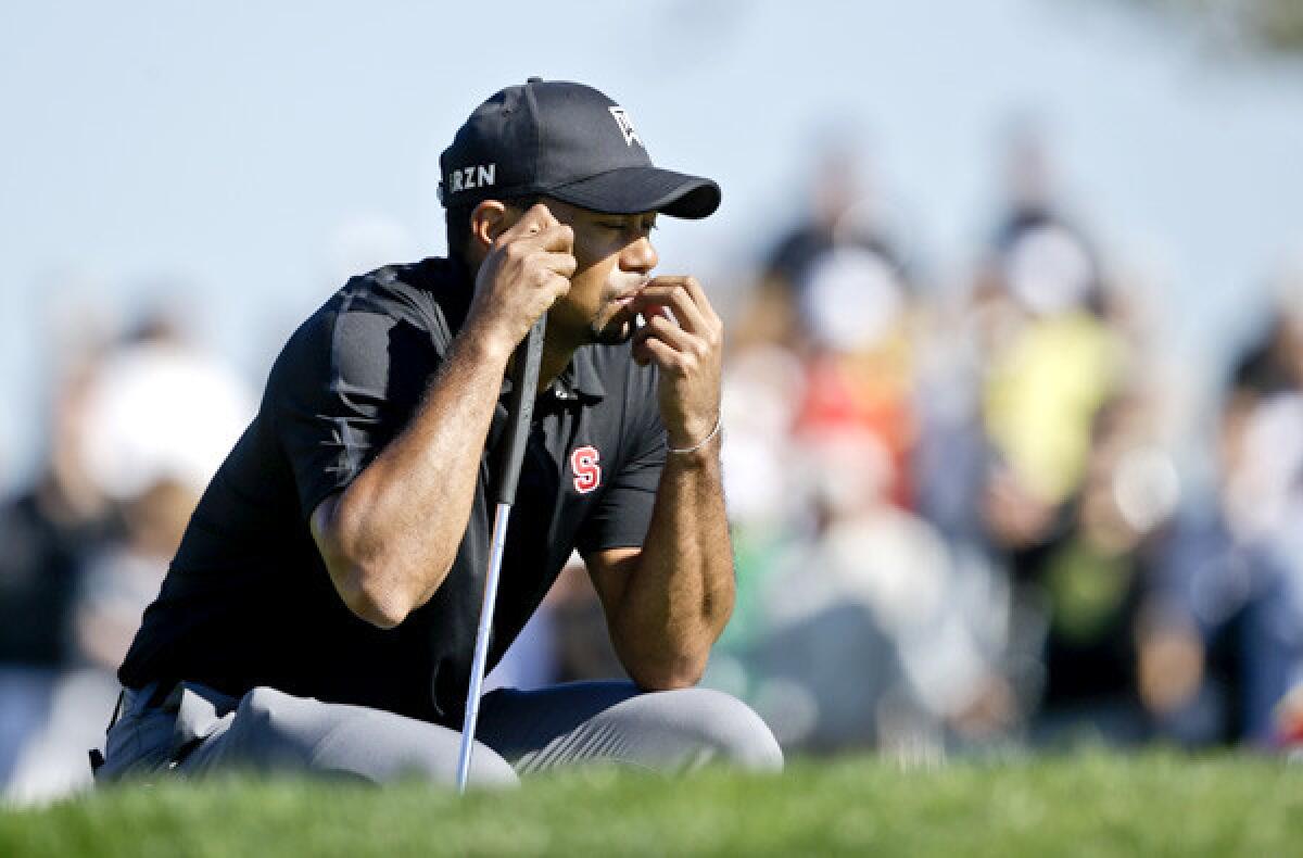 Tiger Woods waits for his turn at the second hole on Torrey Pines' South Course during the third round of the Farmers Insurance Open on Saturday.