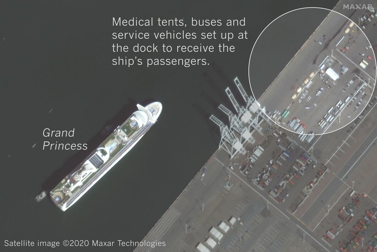 A satellite image shows the Grand Princess arriving at the Port of Oakland on Monday with support services nearby.