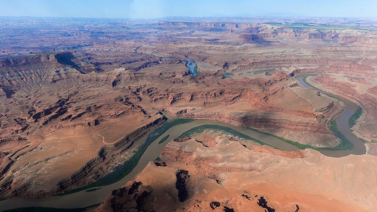 FILE - This May 23, 2016, file photo, shows the northernmost boundary of the proposed Bears Ears region, along the Colorado River, in southeastern Utah. President Donald Trump signed an executive order Wednesday, April 26, 2017, directing his interior secretary to review the designation of dozens of national monuments on federal lands, as he singled out "a massive federal land grab" by the Obama administration. (Francisco Kjolseth/The Salt Lake Tribune via AP file, File)