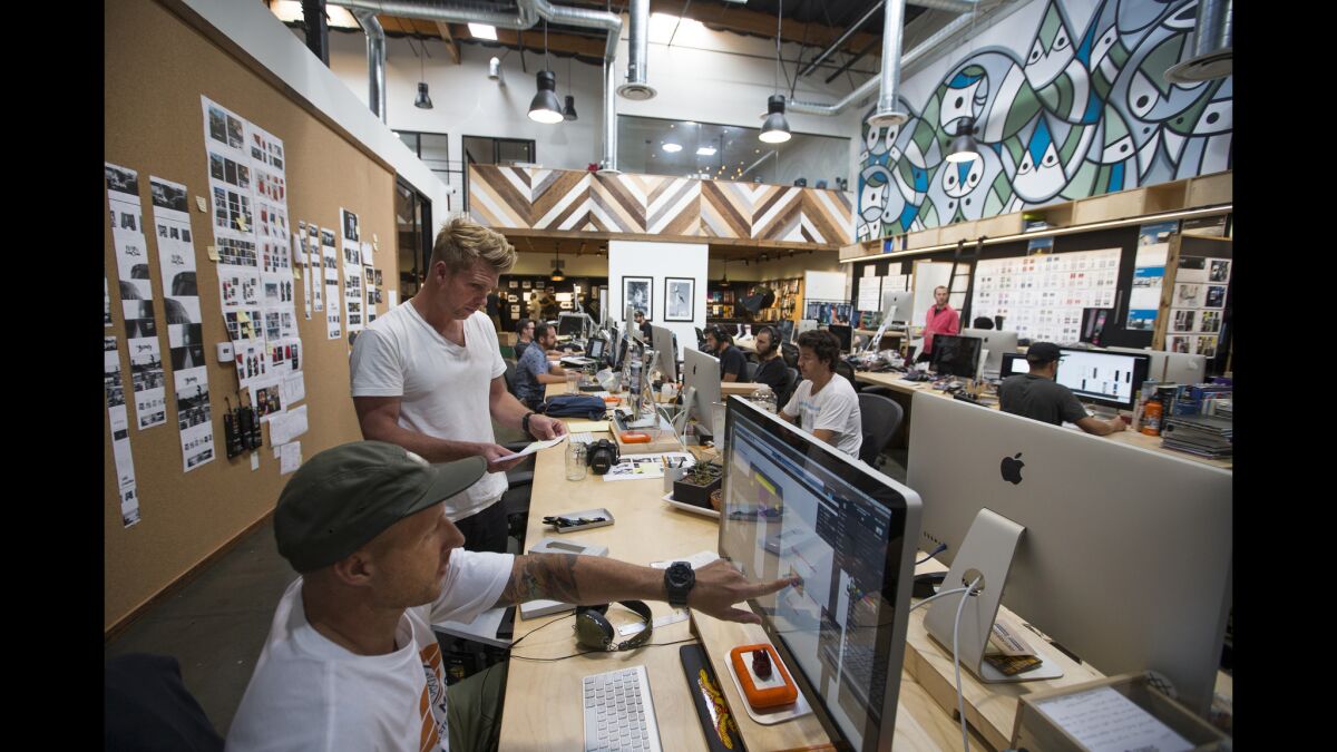 Aaron Hennings, second from left, co-founder and chief creative officer of Stance, works with Brandon Christensen, left, a senior designer, on a design.