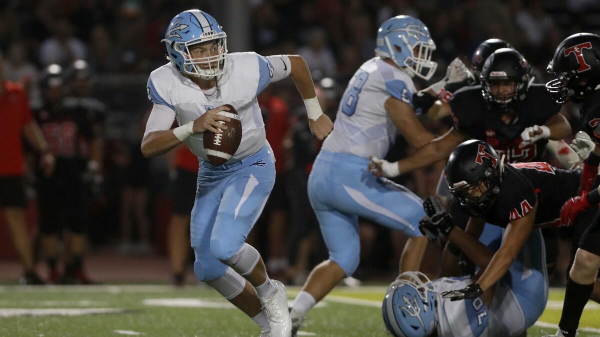 Corona del Mar High quarterback Ethan Garbers, pictured scrambling at San Clemente on Sept. 14, has the Sea Kings rolling into Saturday's CIF Southern Section Division 4 championship game.
