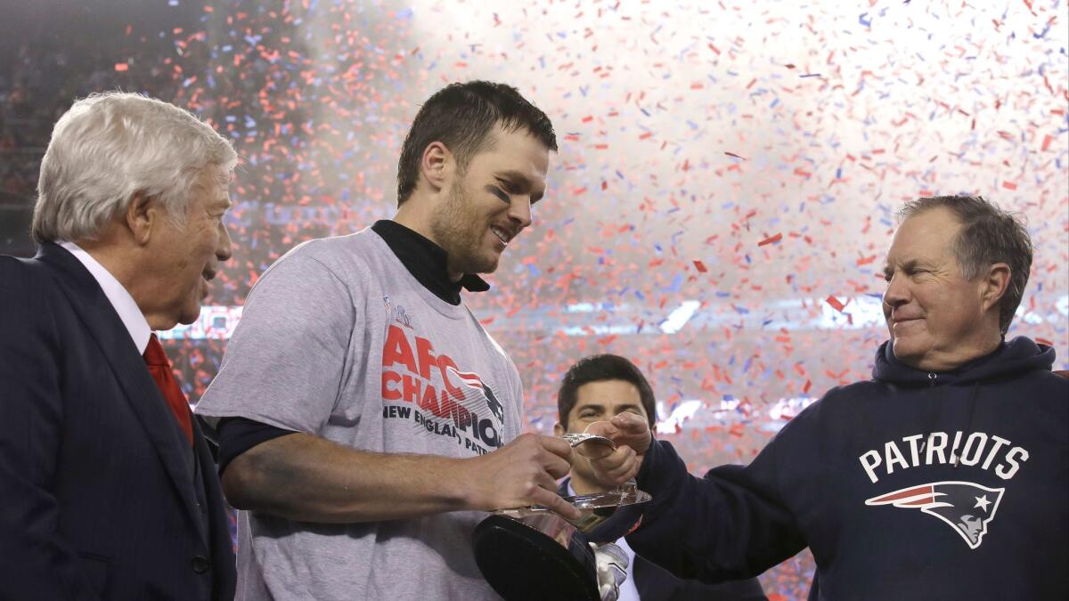 New England Patriots owner Robert Kraft, left, quarterback Tom Brady and coach Bill Belichick celebrate after a win over the Pittsburgh Steelers in the AFC championship game on Jan. 22, 2017.