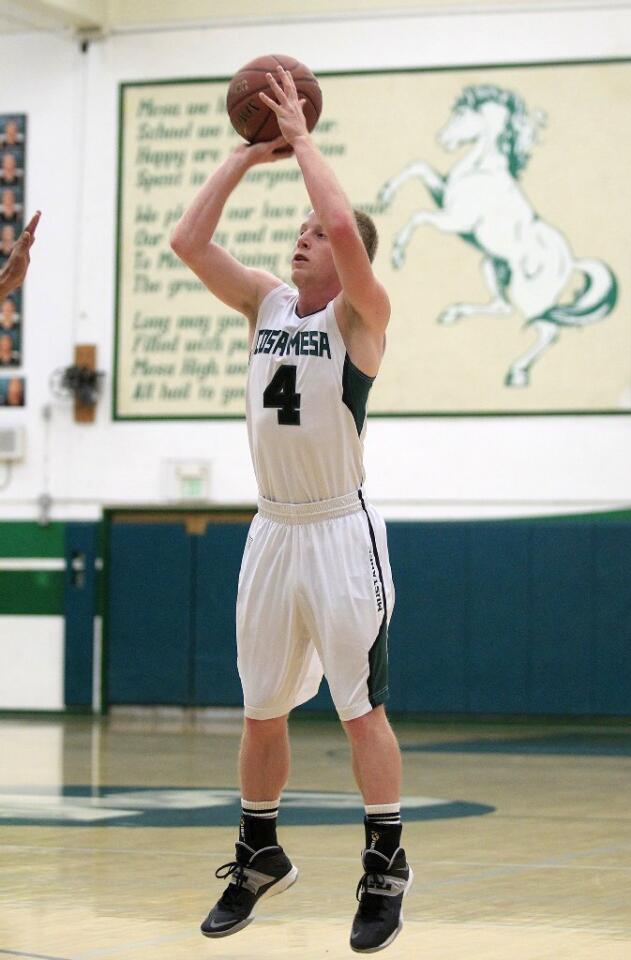 Costa Mesa High's Kyle Hefner (4) attempts a three-pointer during the first half against Harvard-Westlake in a CIF-Southern Section Division 4AA first-round game on Wednesday.