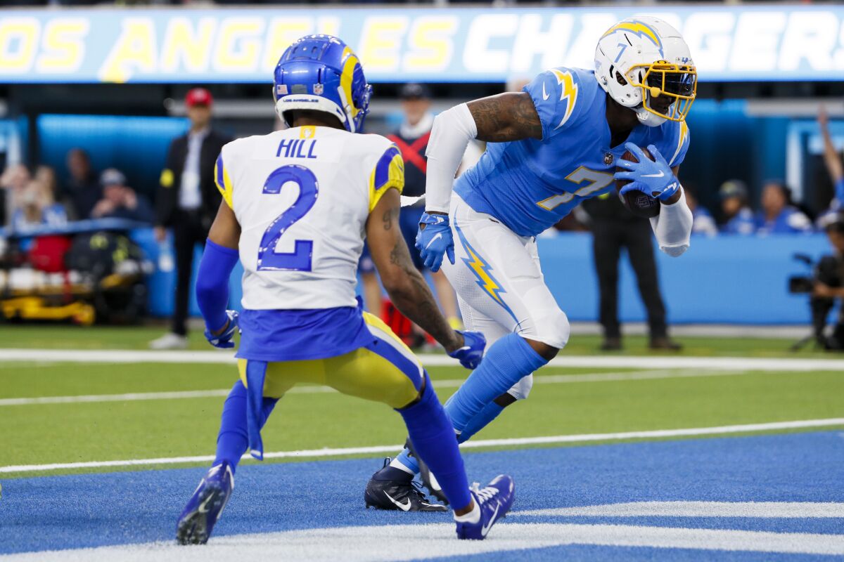 Chargers tight end Gerald Everett (7) catches a touchdown pass in front of Rams cornerback Troy Hill.