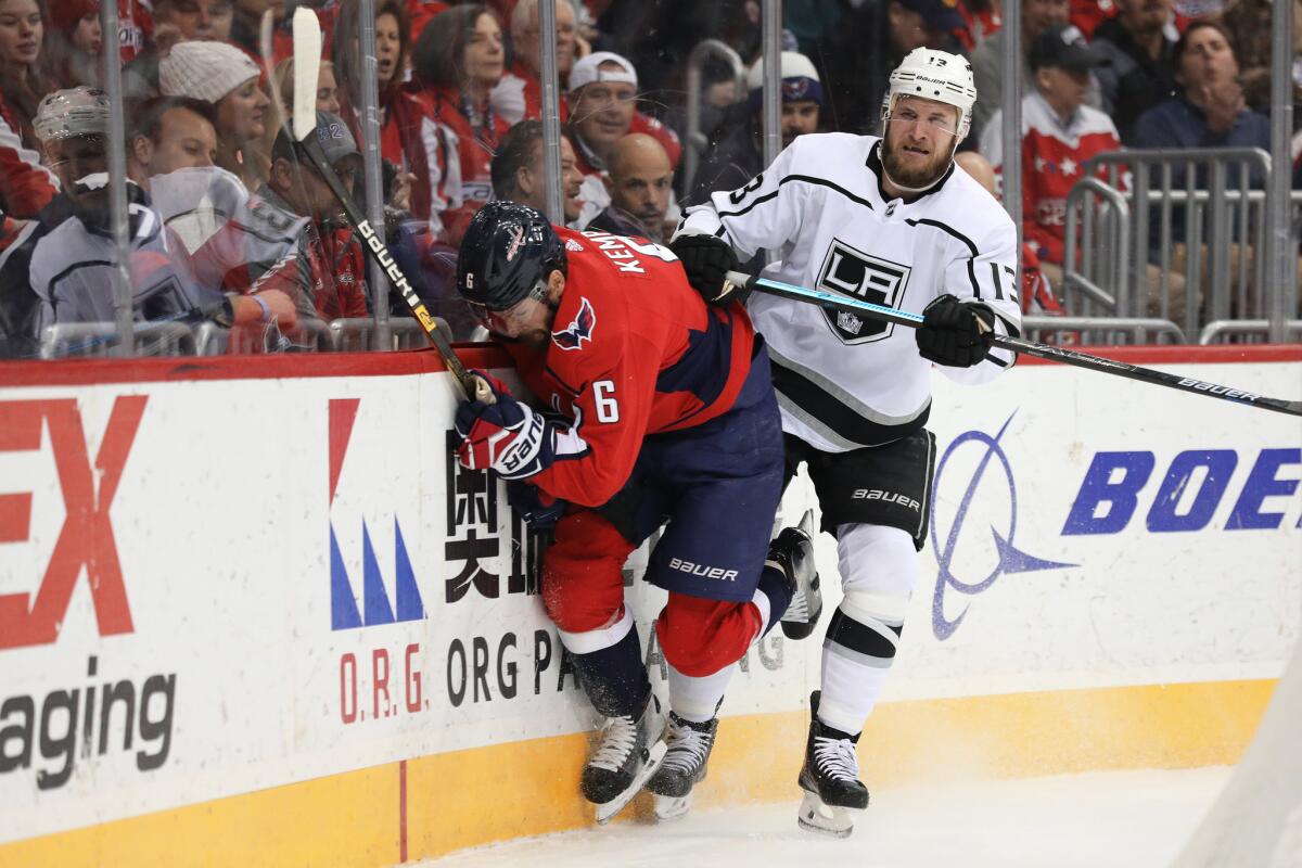 Kings' Kyle Clifford checks Washington's Michal Kempny on Feb. 11 at Capital One Arena.