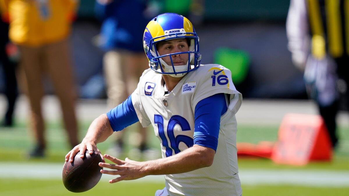 Rams quarterback Jared Goff goes back to pass.