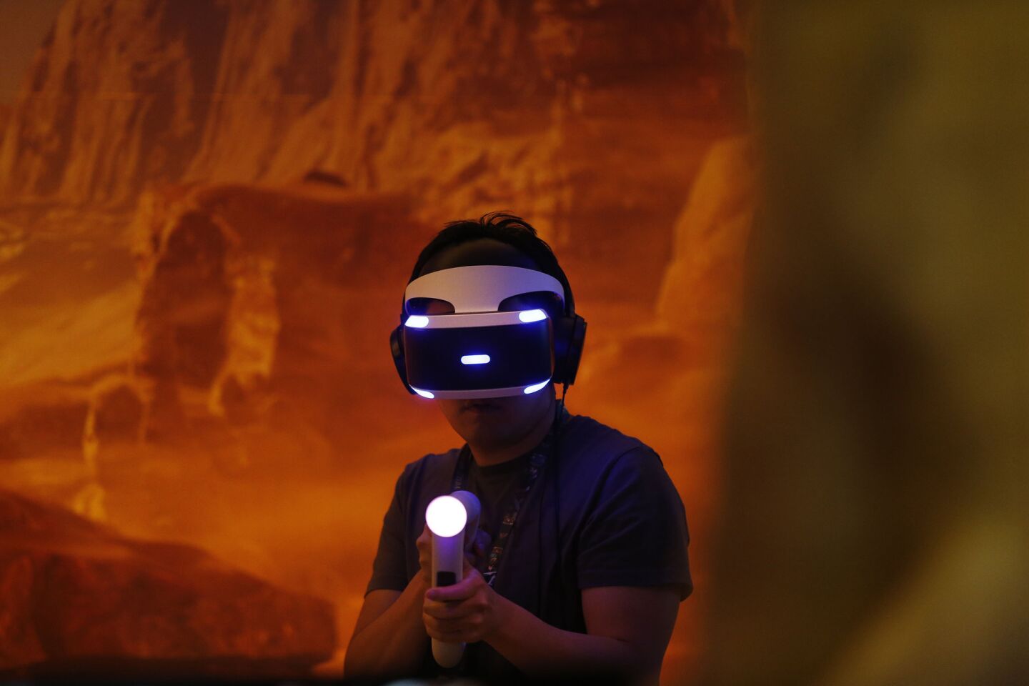 A game enthusiast plays Sony PlayStation's new VR game "Farpoint" during the Electronic Entertainment Expo (E3) June 14-16 at the Los Angeles Convention Center on June 14, 2016.
