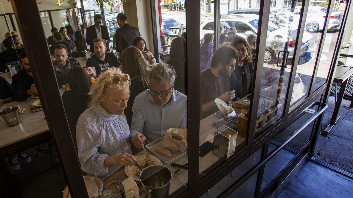 Every seat is taken during the lunch rush at Hasiba restaurant.