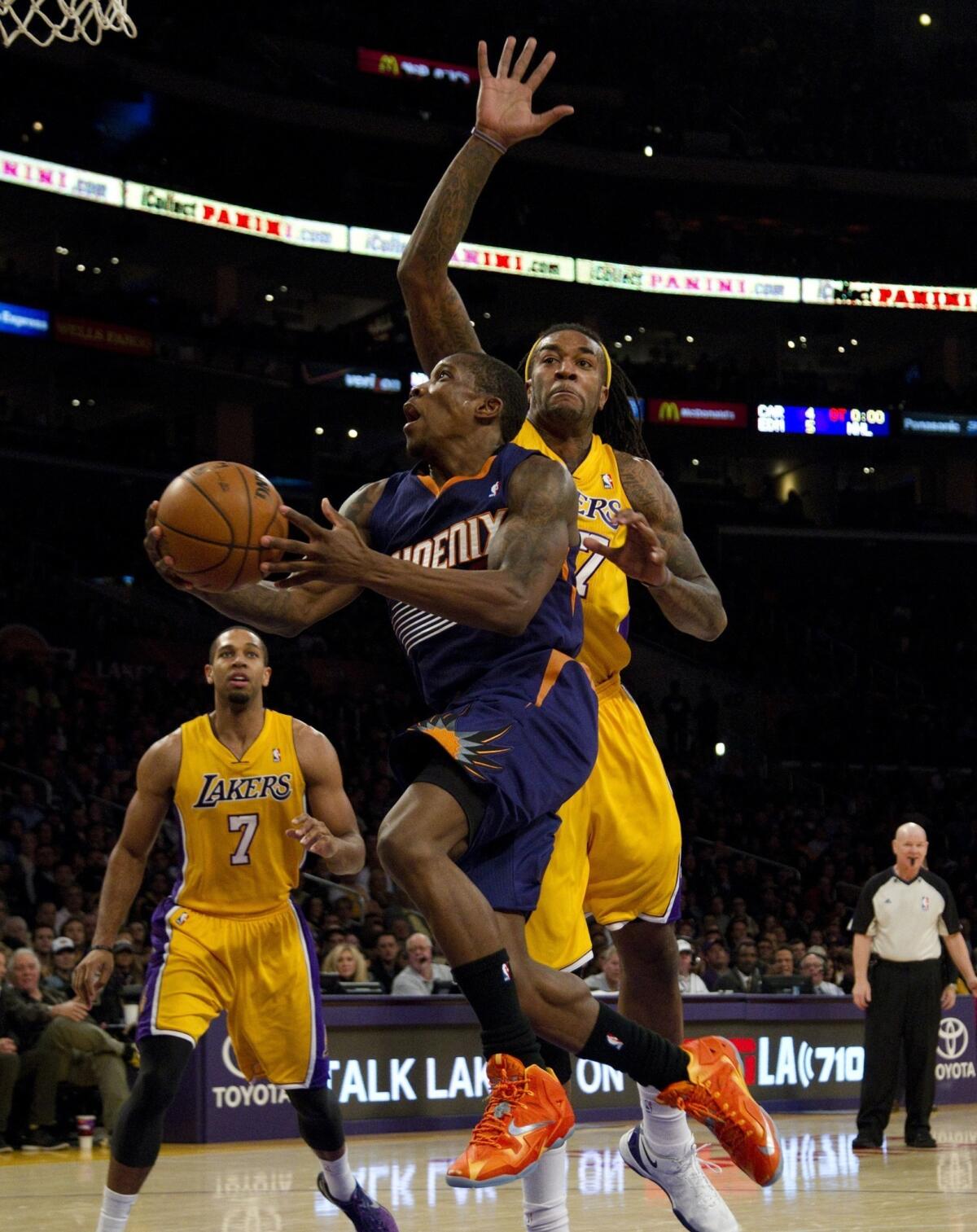 Phoenix Suns point guard Eric Bledsoe scores in front of Lakers center Jordan Hill during the Lakers' 114-108 loss Tuesday at Staples Center.