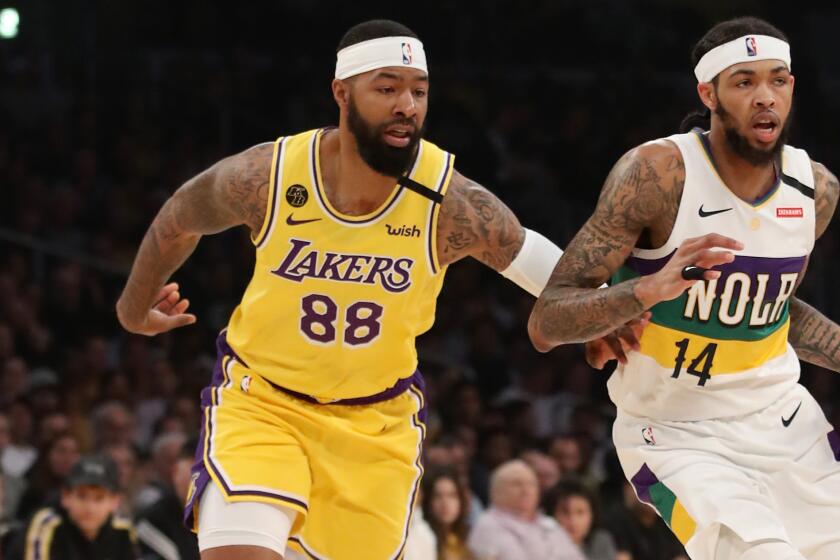 LOS ANGELES, CALIFORNIA - FEBRUARY 25: Brandon Ingram #14 of the New Orleans Pelicans handles the ball against Markieff Morris #88 of the Los Angeles Lakers during the first half at Staples Center on February 25, 2020 in Los Angeles, California. NOTE TO USER: User expressly acknowledges and agrees that, by downloading and or using this Photograph, user is consenting to the terms and conditions of the Getty Images License Agreement. (Photo by Katelyn Mulcahy/Getty Images)