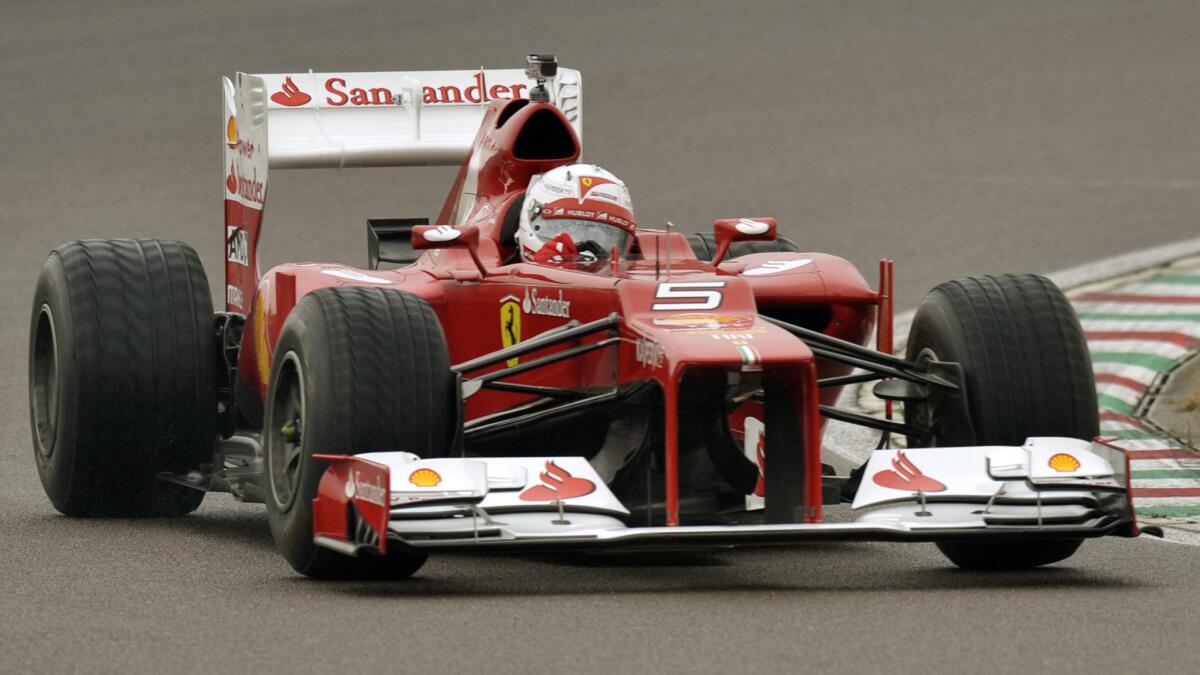 Sebastian Vettel drives F2012 at Ferrari's Fiorano circuit in Italy on Nov. 29. The four-time Formula One champion will race for Ferrari in 2015.