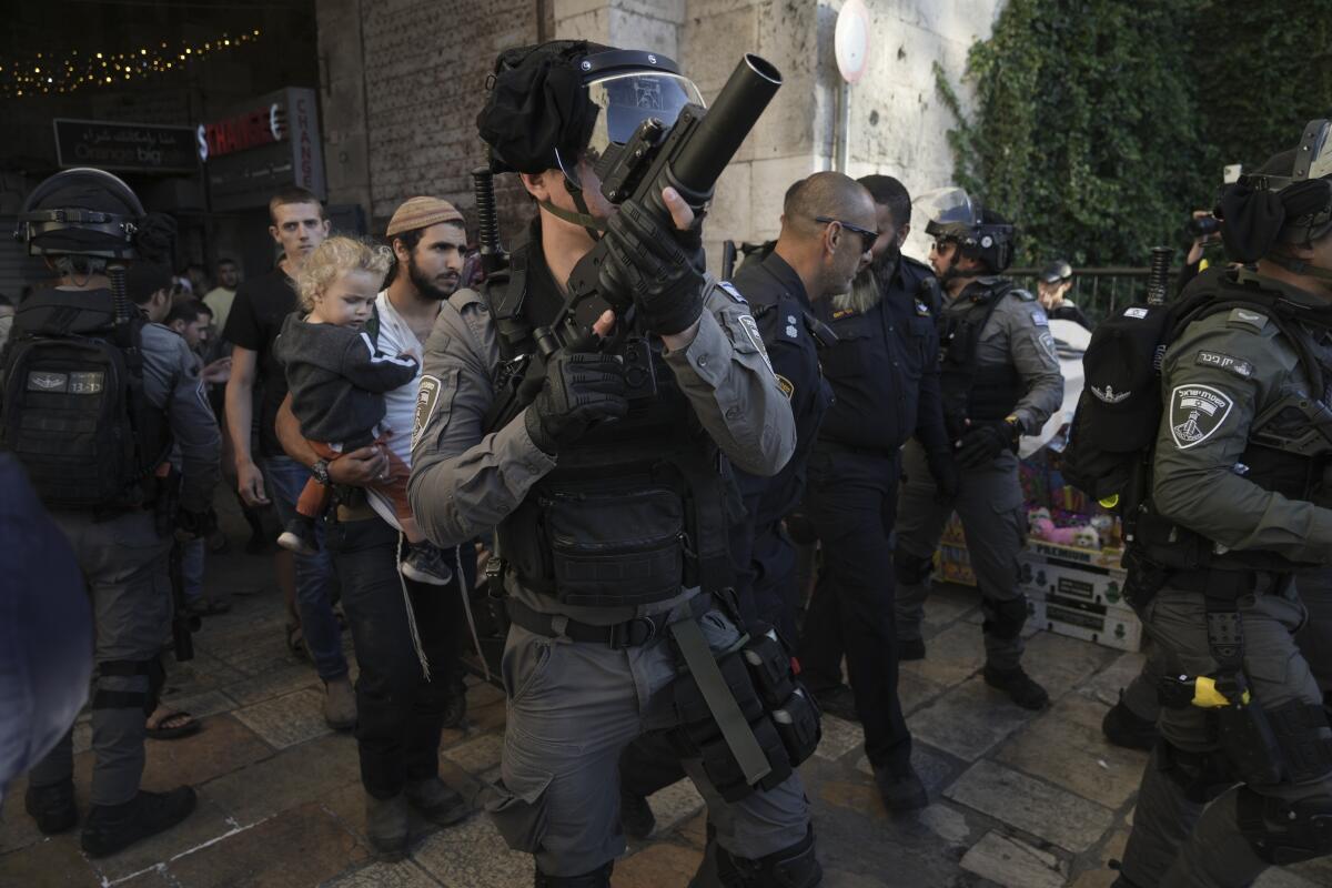 Israeli security forces escorting Jews in Jerusalem's Old City