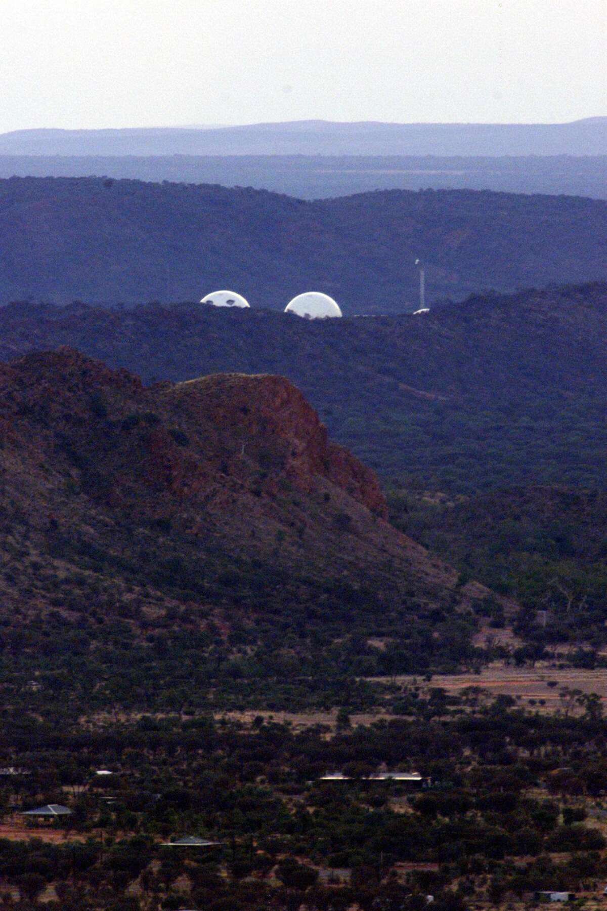 The radar domes of the joint U.S.-Australian missile defense base at Pine Gap near Alice Springs in central Australia, in a 1999 image.