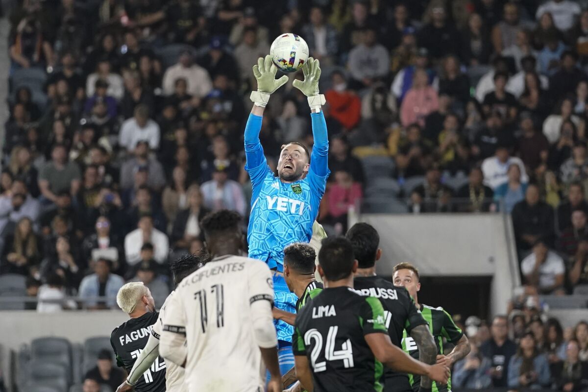 Austin FC goalkeeper Brad Stuver tries to grab the ball during a match against LAFC on May 18.