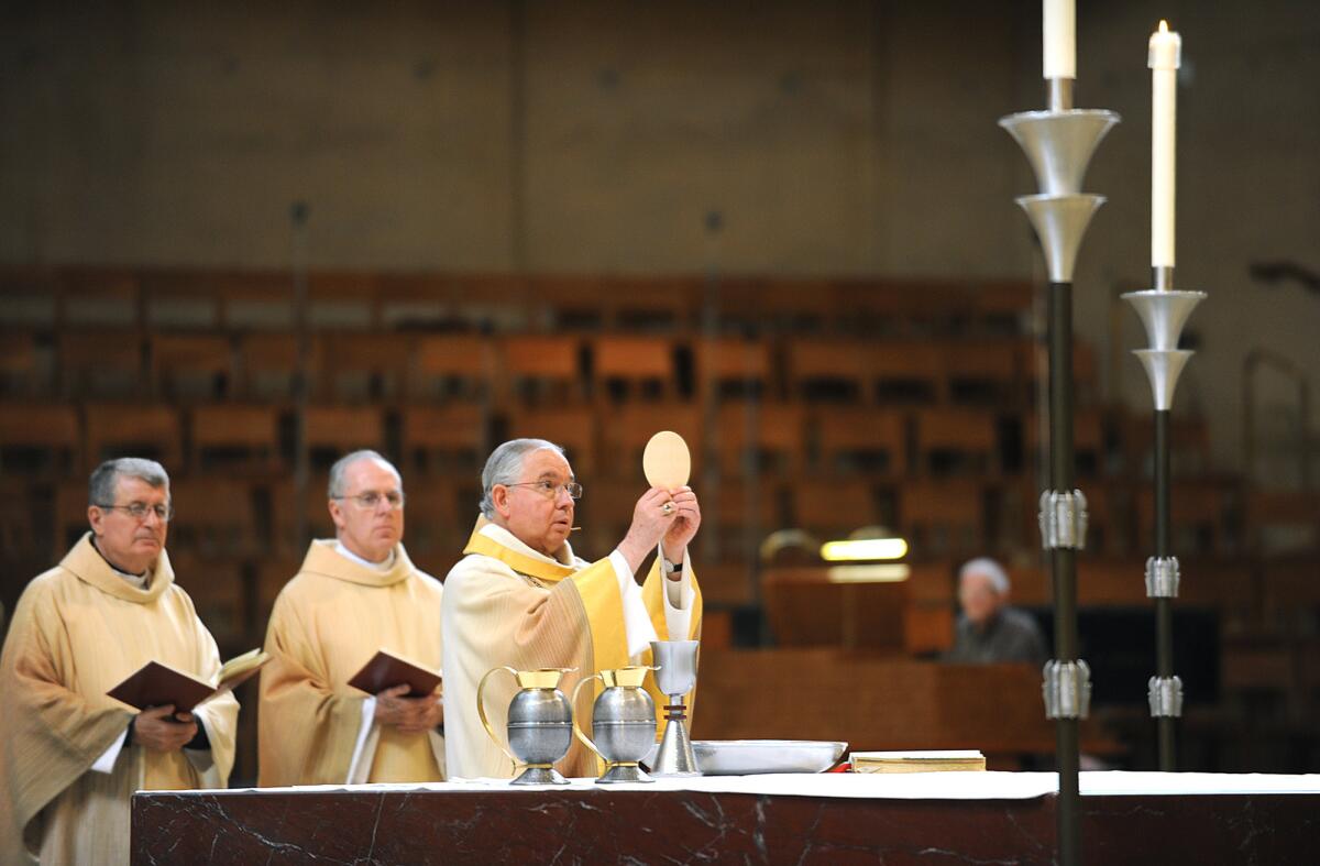 Los Angeles Archbishop Jose H. Gomez says a Mass at the Cathedral of Our Lady of the Angels in downtown L.A. last year.