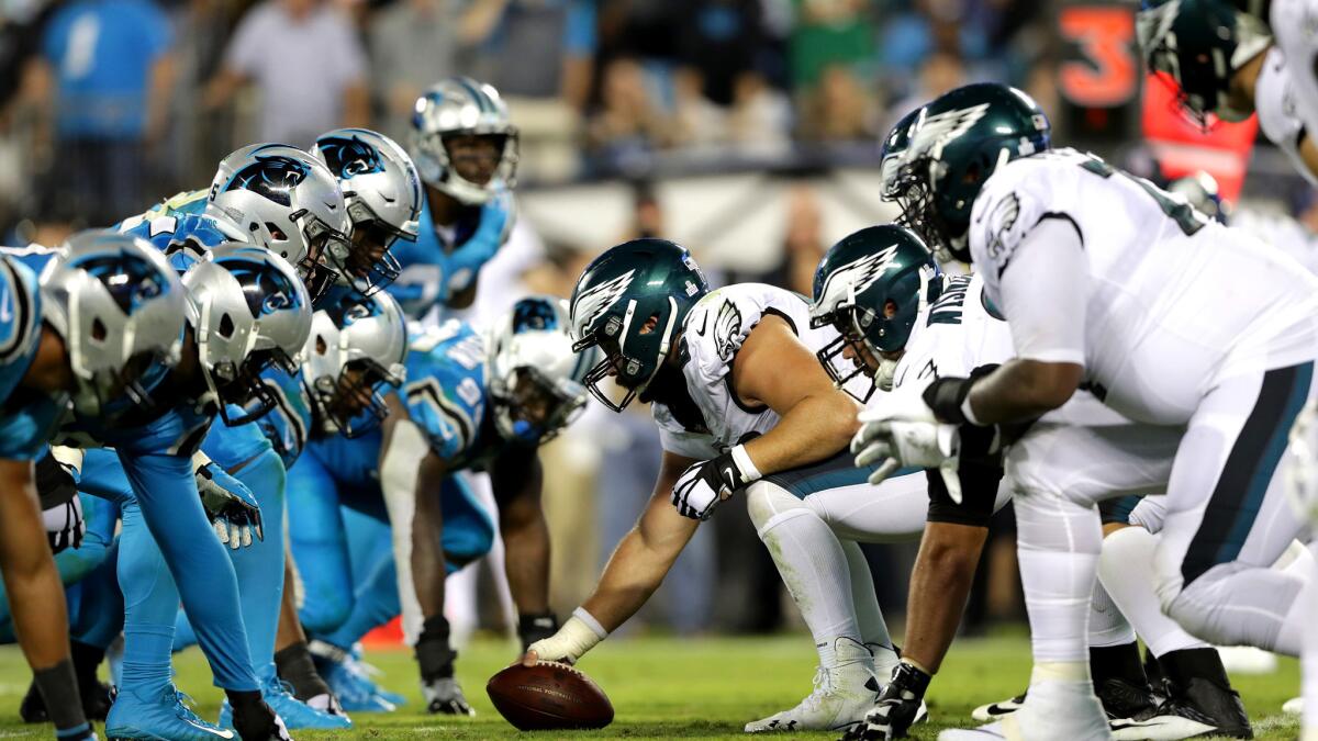 The Eagles' offensive line, right, has helped the team open the season 8-1, including a 28-23 victory over the Panthers.