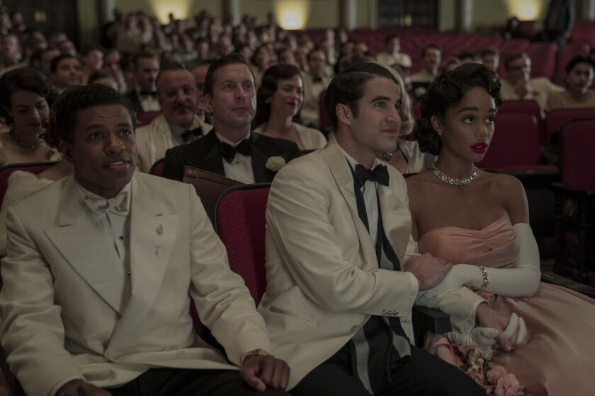 Jeremy Pope, left, Darren Criss and Laura Harrier in a scene from Netflix's "Hollywood."