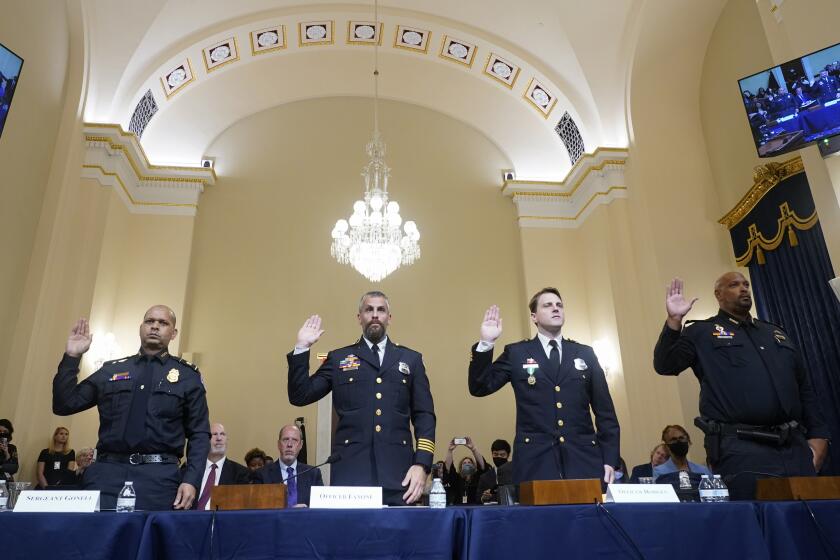 WASHINGTON, DC - JULY 27: (L-R) U.S. Capitol Police Sgt. Aquilino Gonell, Washington Metropolitan Police Department officer Michael Fanone, Washington Metropolitan Police Department officer Daniel Hodges and U.S. Capitol Police Sgt. Harry Dunn are sworn in to testify before the House Select Committee investigating the January 6 attack on the U.S. Capitol on July 27, 2021 at the Cannon House Office Building in Washington, DC. Members of law enforcement testified about the attack by supporters of former President Donald Trump on the U.S. Capitol. According to authorities, about 140 police officers were injured when they were trampled, had objects thrown at them, and sprayed with chemical irritants during the insurrection. (Photo by Andrew Harnik-Pool/Getty Images)