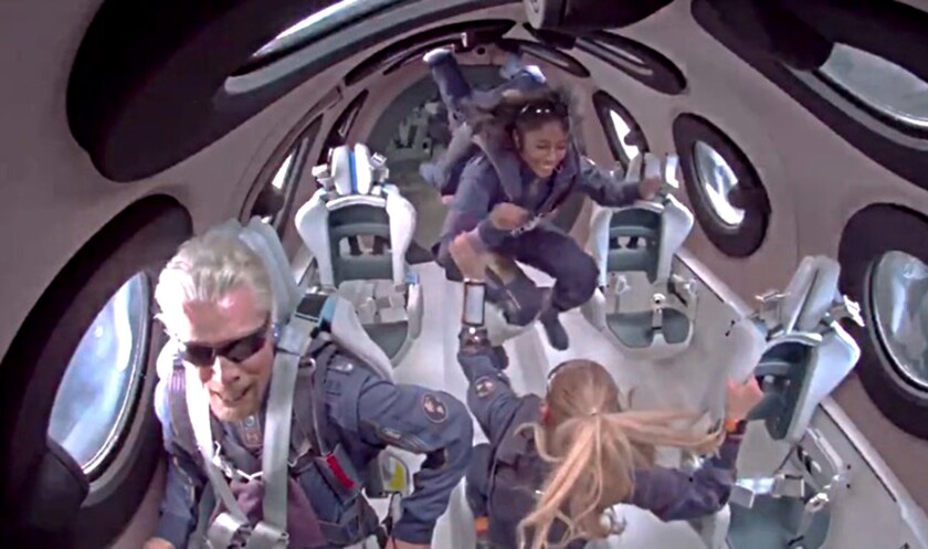 Richard Branson and his Virgin Galactic crew members experience zero gravity.