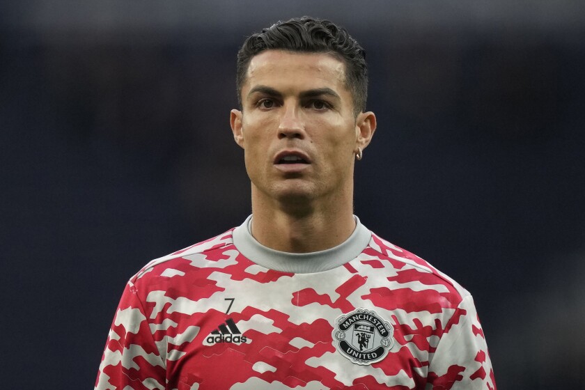 FILE - Manchester United's Cristiano Ronaldo warms up ahead of an English Premier League soccer match at the Tottenham Hotspur Stadium in London on Oct. 30, 2021. A bid by the New York Times to obtain a Las Vegas police file compiled about Cristiano Ronaldo after a Nevada woman claimed in 2018 that the international soccer star raped her in 2009 could be moved from federal to state court. (AP Photo/Frank Augstein, File)