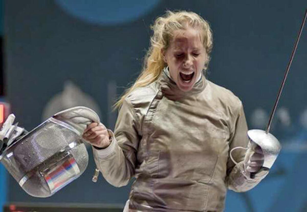 Mariel Zagunis wins a fencing competition in October 2011.