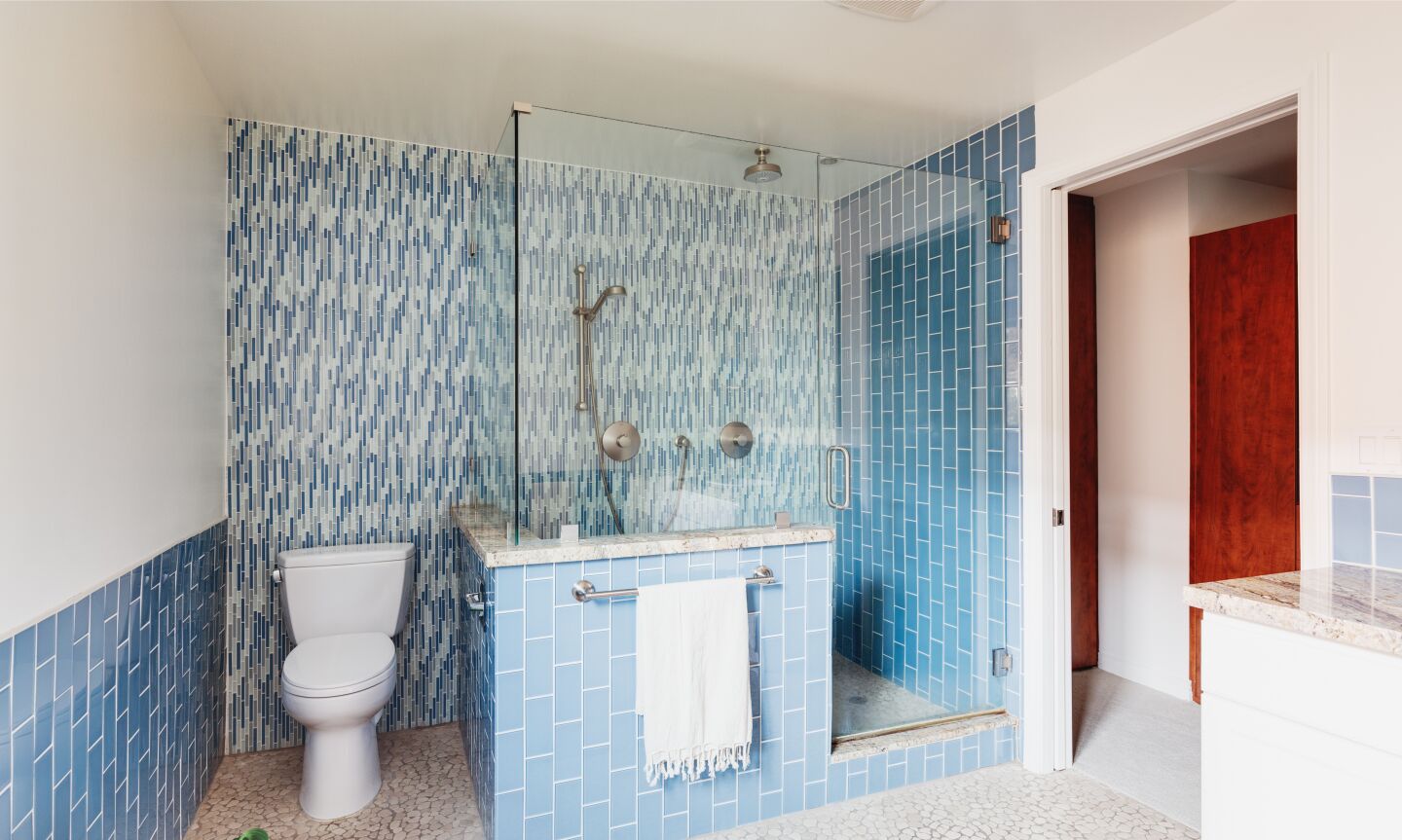 The bathroom in shades and patterns of blue.