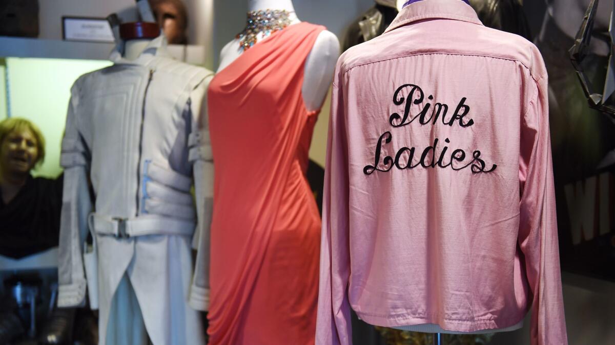 Hollywood wardrobes, including a shirt worn by Dinah Manoff in "Grease," right, are displayed in the Paramount archives.