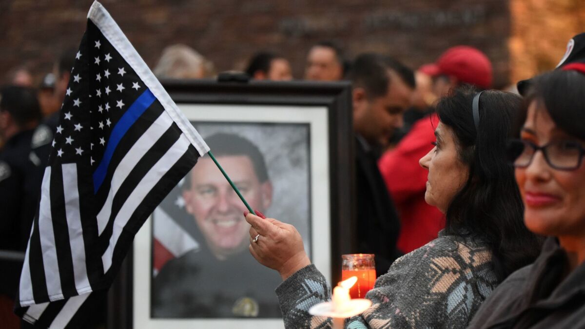 Slain officer Keith Boyer is remembered during a vigil at the Whittier police station on Feb. 20.