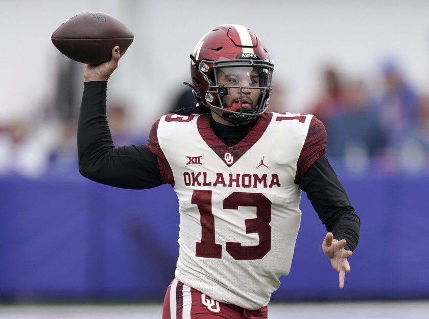 Caleb Williams passes the ball during a game between Oklahoma and Kansas in October.