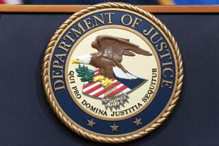 FILE - The Department of Justice seals is seen during a news conference at the DOJ office in Washington, May 16, 2023. (AP Photo/Jose Luis Magana, File)