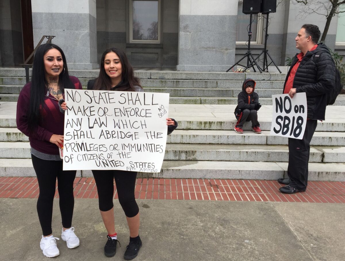 Denise Aguilar or Stockton, with daughter Angelique, 18, protesting a bill dubbed the Children's Bill of Rights.