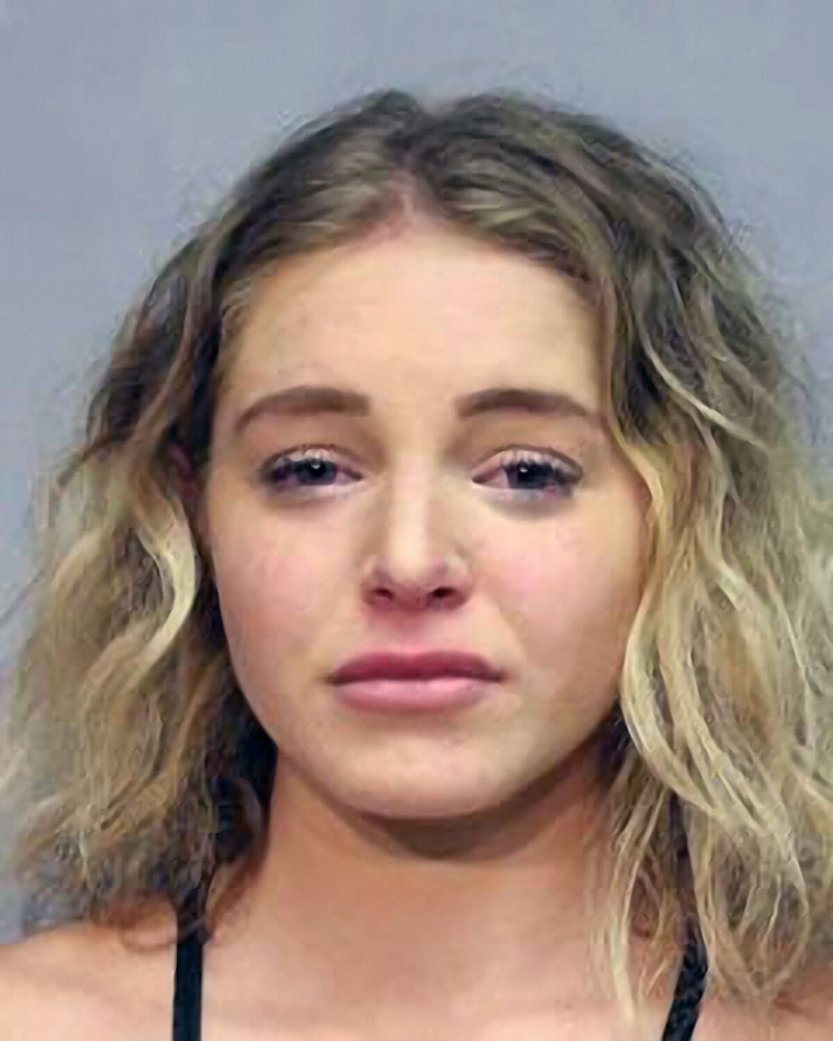 This photo provided by the Hawaii Police Department shows Courtney Clenney. Law enforcement in Hawaii on Wednesday. Aug. 10, 2022 arrested social media model Courtney Clenney on a charge of second-degree murder with a deadly weapon. Hawaii County police said in a statement they assisted the U.S. Marshals Service as they arrested the 26-year-old on the Big Island. (Hawaii Police Department via AP)