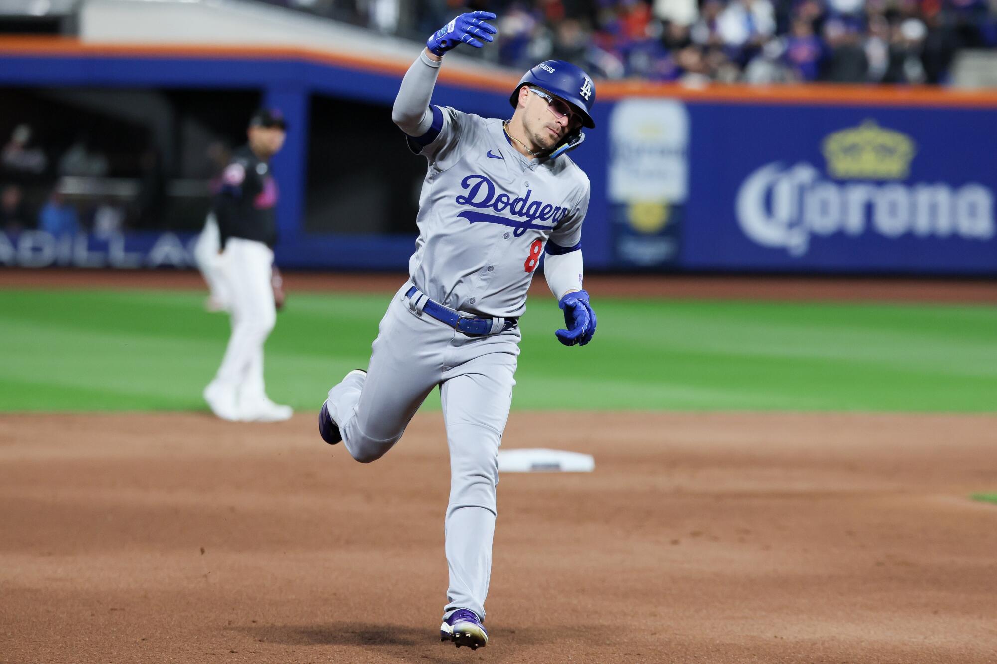 Kiké Hernández celebrates after hitting a two-run home run for the Dodgers in the sixth inning against the New York Mets.