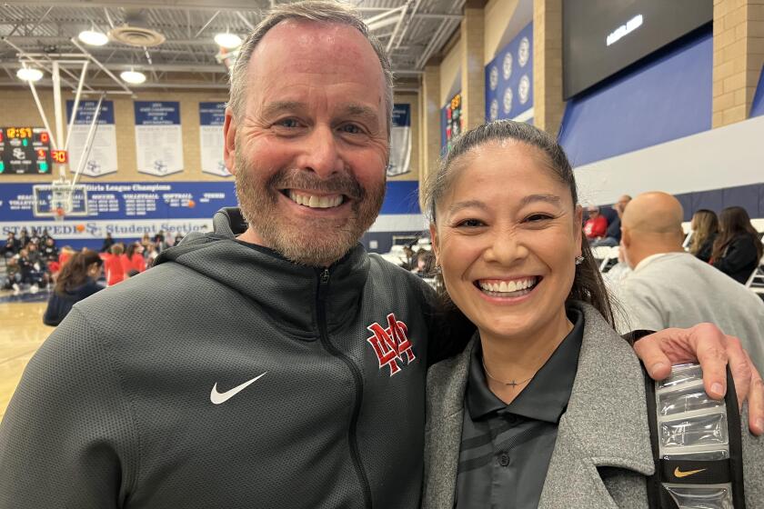 Mater Dei girls' basketball coach Kevin Kiernan with Sierra Canyon coach Alicia Komaki,