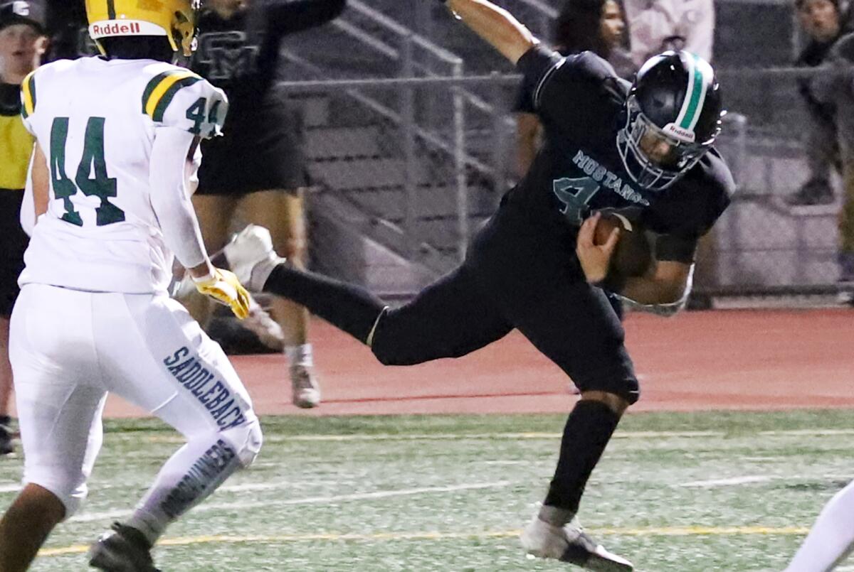 Costa Mesa's Edward Franco (44) makes an acrobatic catch to get close to the goal line against Saddleback on Friday.