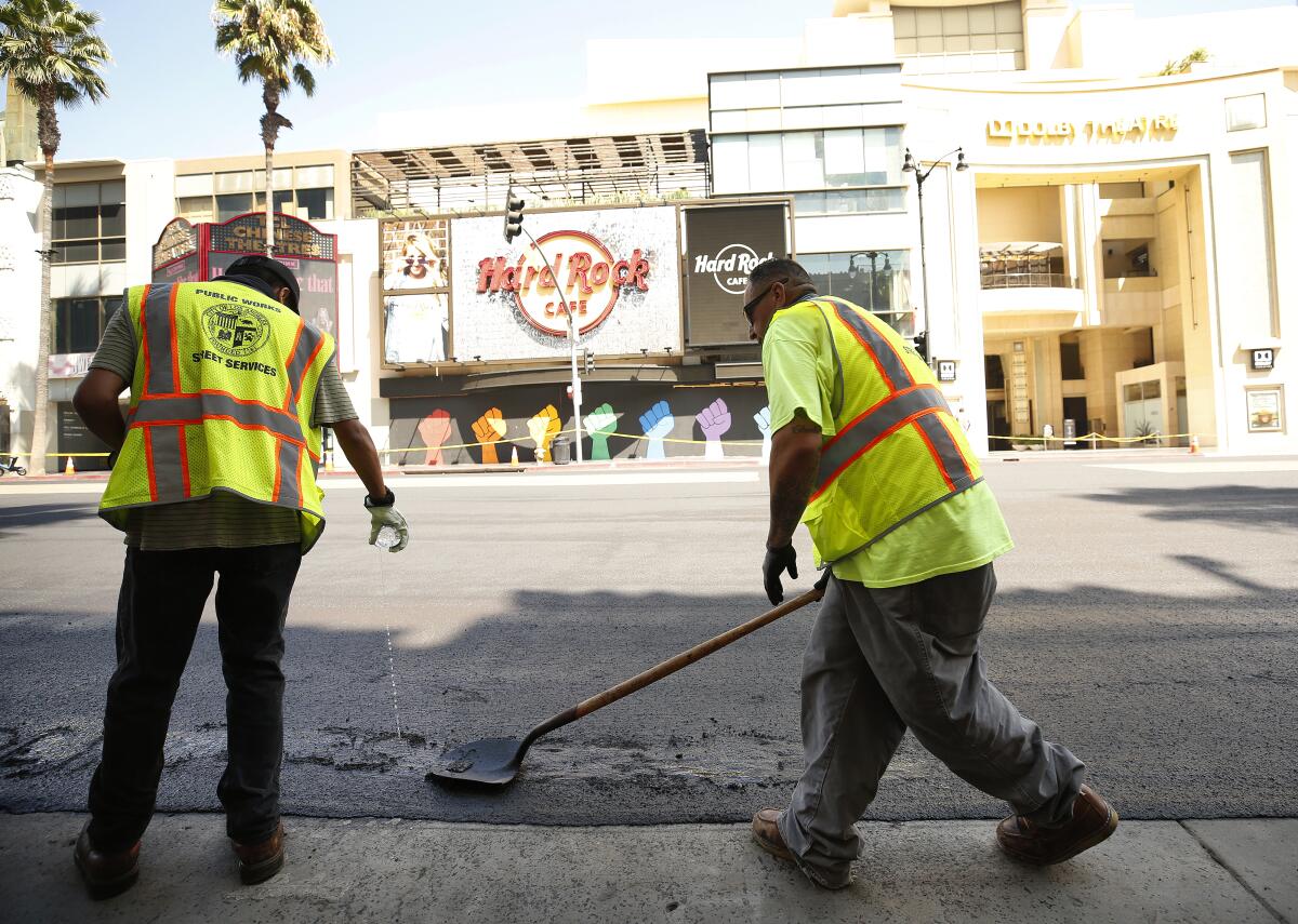 Crews from the Los Angeles Bureau of Street Services make road repairs.