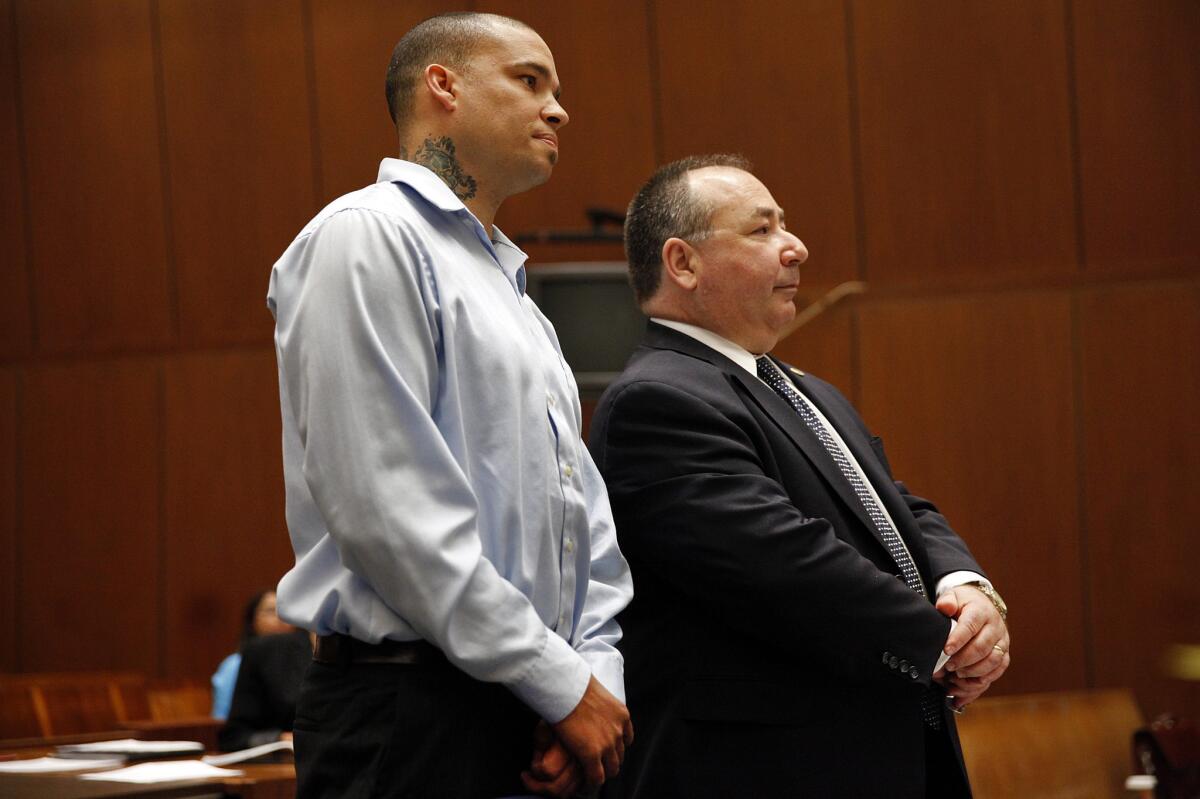 Marcel Melanson, left, the former Compton fire battalion chief, pleaded no contest to arson and embezzlement Tuesday.