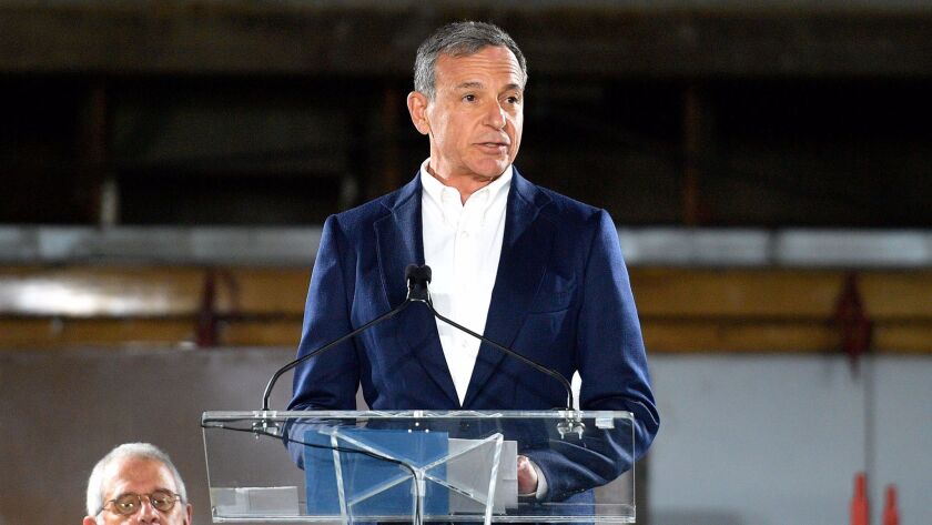 Walt Disney Co. Chief Executive Bob Iger may stay at the company longer than expected if the company buys entertainment assets from 21st Century Fox.