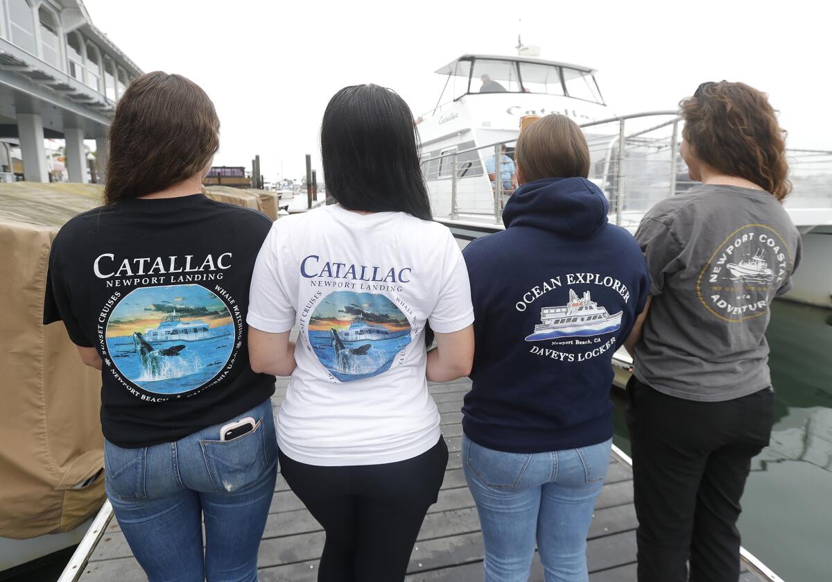 Captains Kayla Smith, Dani Fasser, Angela Syswerda and Erica Page proudly wear their boat shirts on Thursday.